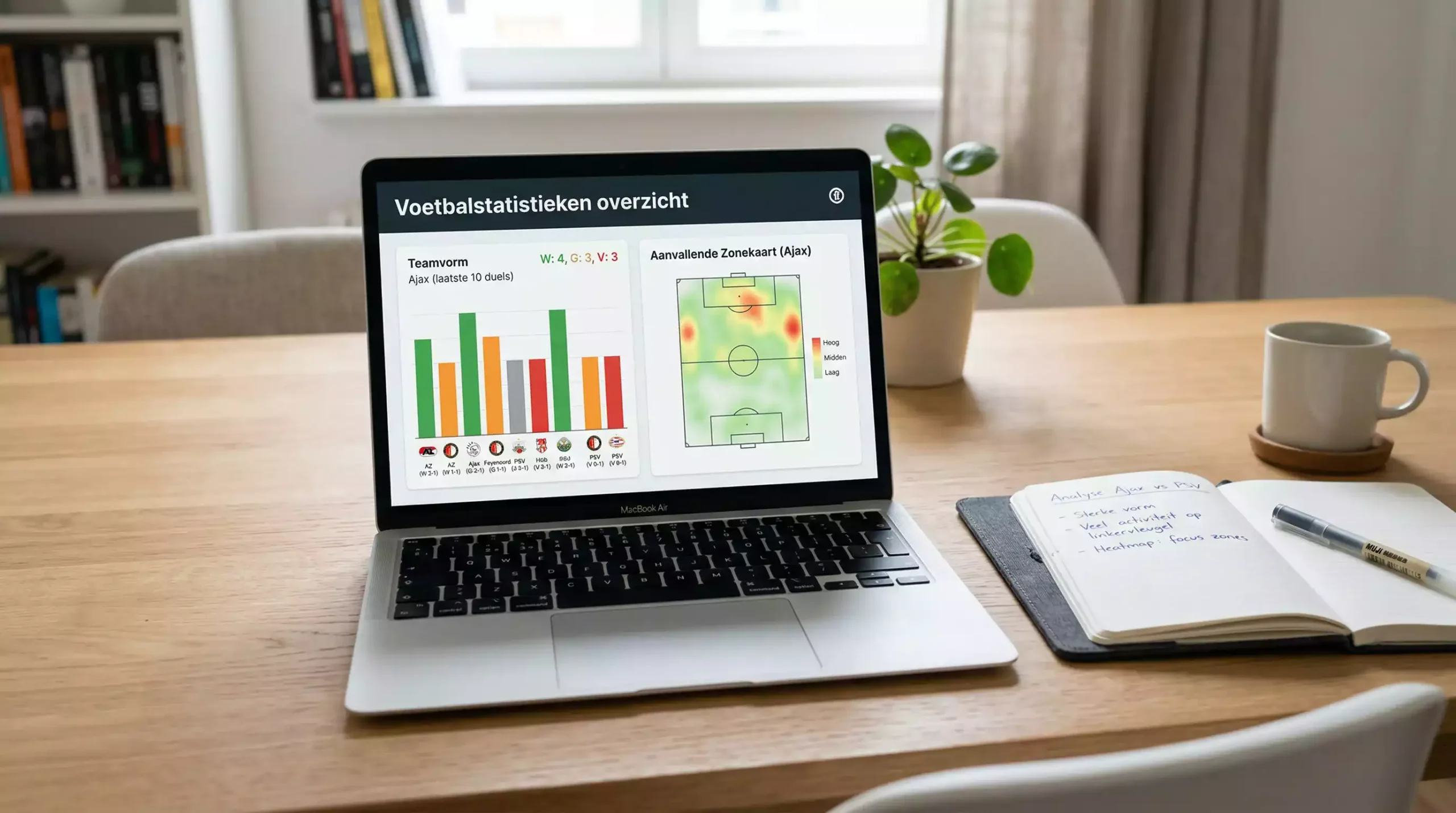 Laptop met voetbalstatistieken en grafieken op het scherm